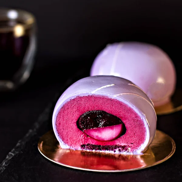 Violet cake. Cake with black currant. Round cake in a mirror glaze.