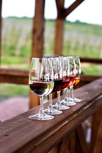 Glasses with wine. Red, pink, white wine in glasses.