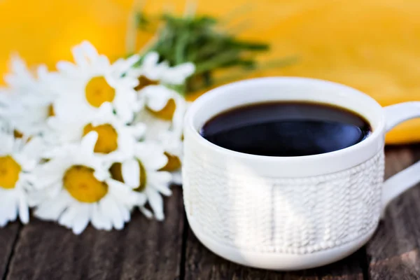 Espresso coffee and summer flowers.