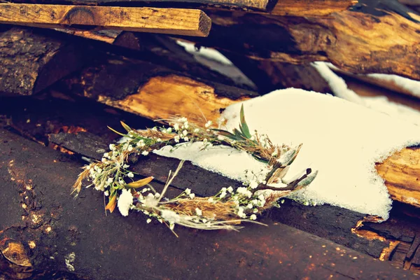 Winter wedding   bouquet of the bride. Beautiful winter wedding bouquet with cones, cotton and spruce branches. Bouquet for the bride for the wedding in the winter woods.