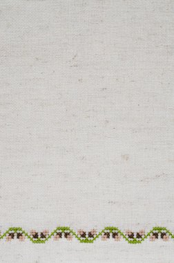 Nakış ile bej keten kumaş dokusuna.