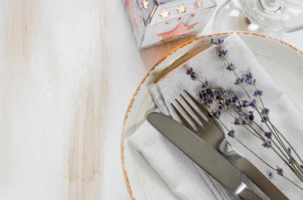 Festive table setting with candles and lavender. — Stock Photo, Image