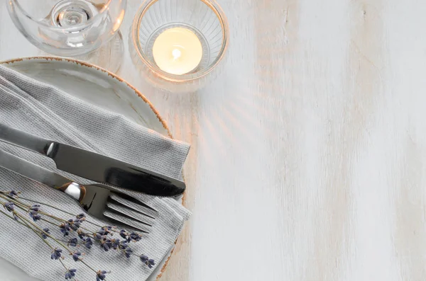 Festive table setting with candles and lavender. — Stock Photo, Image