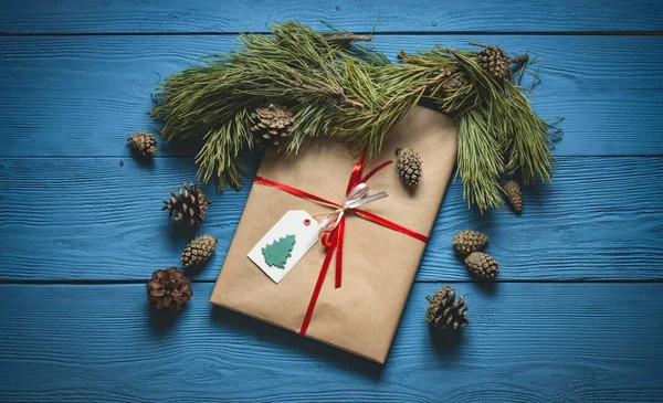 Christmas gift on blue wooden boards — Stock Photo, Image