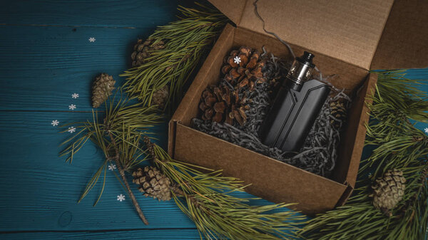 black vaporizer out of a gift box 
