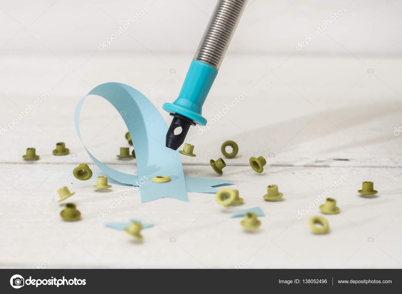 Close Up Of A Decorative Hole Punch And Grommet Stock Photo