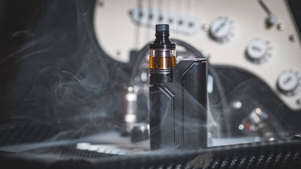 black vaporizer in the smoke