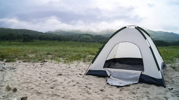 Tourist tent on the sandy shore — Stock Photo, Image