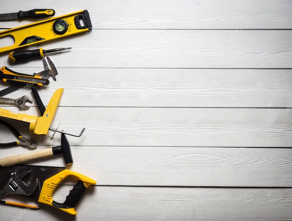 The layout of tools on white wooden