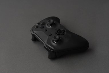 Minimalistic black: close-up of the gamepad on a black background.