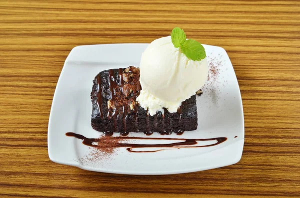 Chocolate brownie with ice cream and banana — Stock Photo, Image