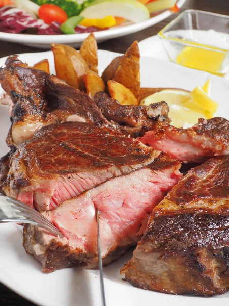 Knife cut slice of grilled meat — Stock Photo, Image