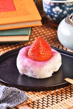 Strawberry Daifuku on black tray clipart