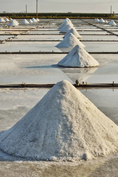 Dried salt at salt pan ready for harvesting in Tainan, Taiwan                                                                                                                                 Salt pans in Tainan, Taiwan