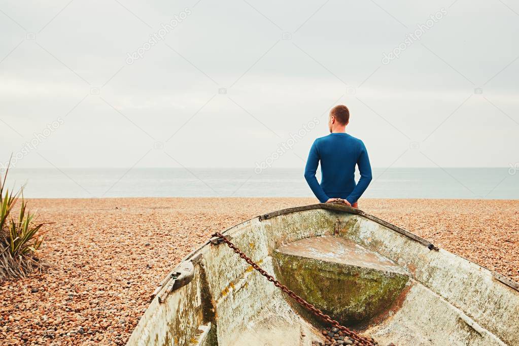 Alone and pensive man on the beach