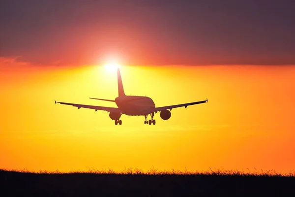 Airplane at the sunset — Stock Photo, Image