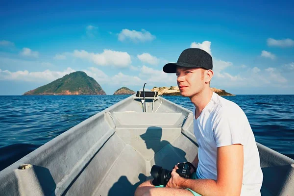 Photographer traveling by boat — Stock Photo, Image
