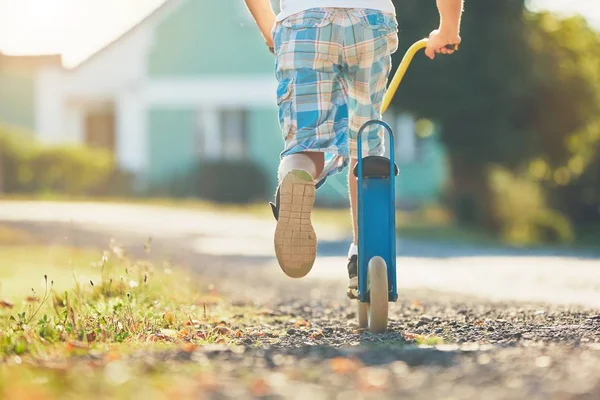 Boy with push scooter — Stock Photo, Image