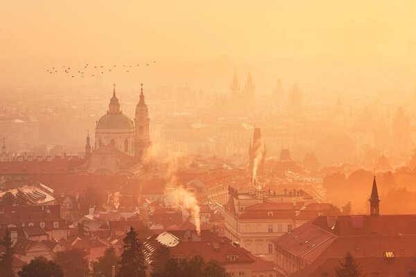 Foggy morning in the city. Prague Skyline at the sunrise.