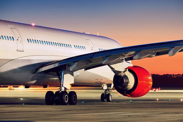 Airplane at the amazing sunset