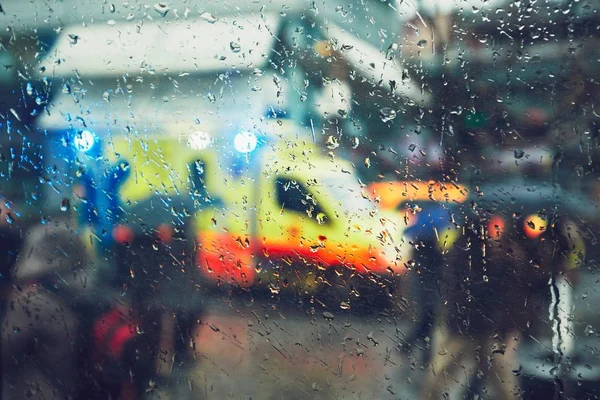 Emergency medical service in the rain — Stock Photo, Image