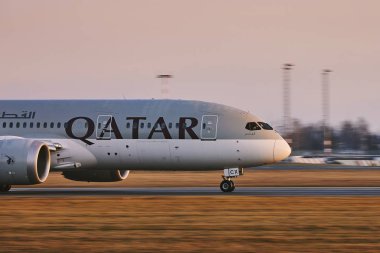Qatar Airways Boeing 787 Dreamliner during take off clipart