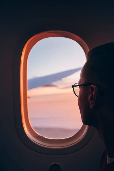 Man Looking Throught Window Airplane Flight Clouds Sunset — Stock Photo, Image