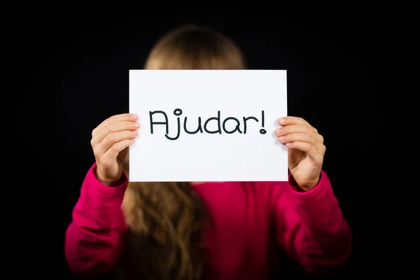 Child holding sign with Portuguese word Ajudar - Help — Stock Photo, Image