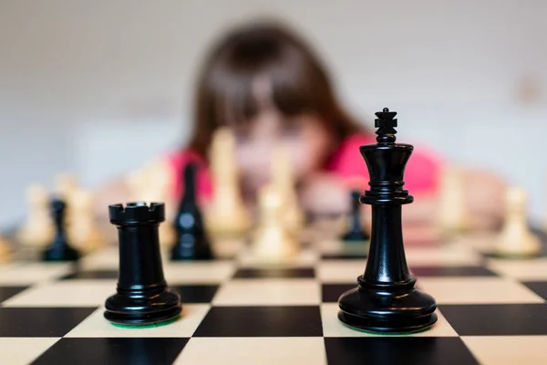 Girl and chess board — Stock Photo, Image