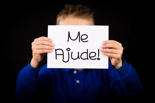 Dítě drží ceduli s portugalského slova mě Ajude - Pomozte mi — Stock fotografie