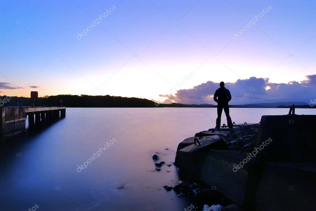 Standing alone by the lake