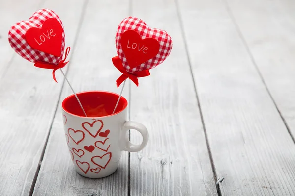 Valentines day background with two hearts in cup — Stock Photo, Image