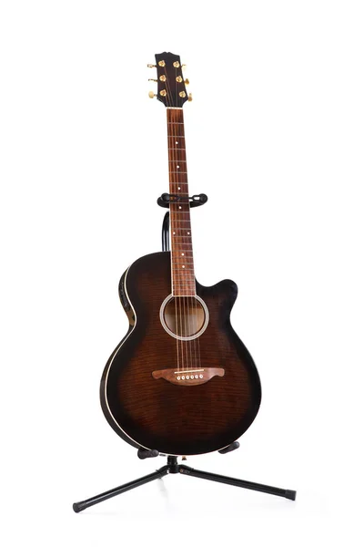 Acoustic guitar on holder isolated on white background — Stock Photo, Image