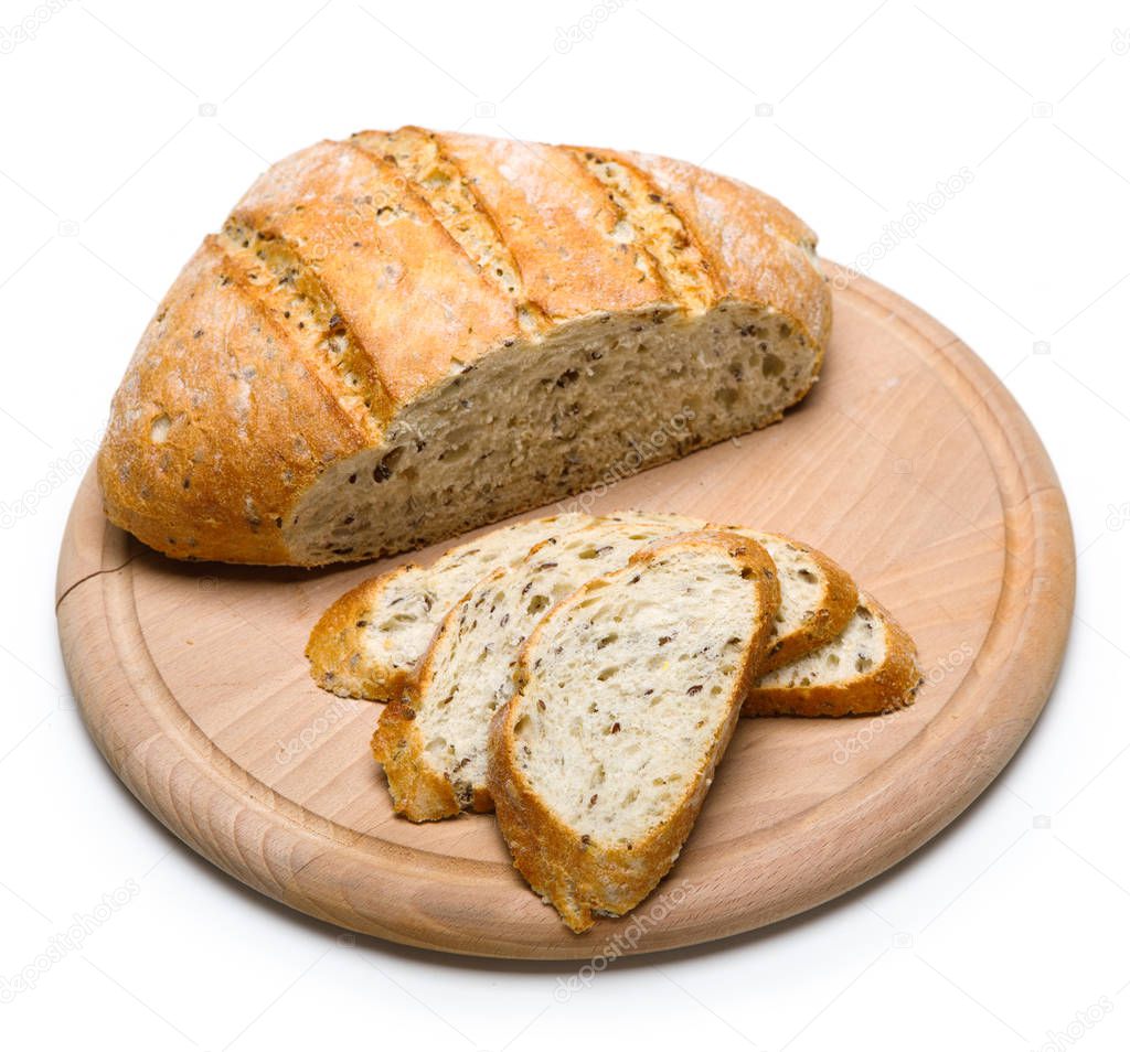 Freshly baked bread on wooden cutting board isolated on white ba