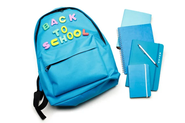 Backpack with school supplies, isolated on white — Stock Photo, Image