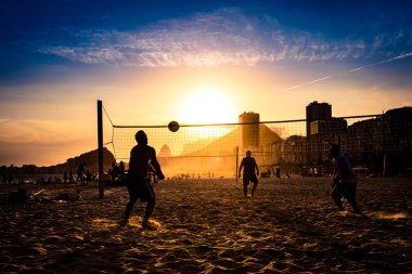 Brazilians Playing Beach Volleyball clipart