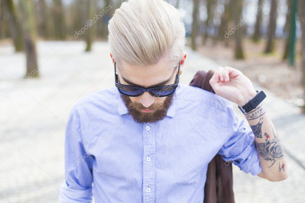 Fashionable hipster in park