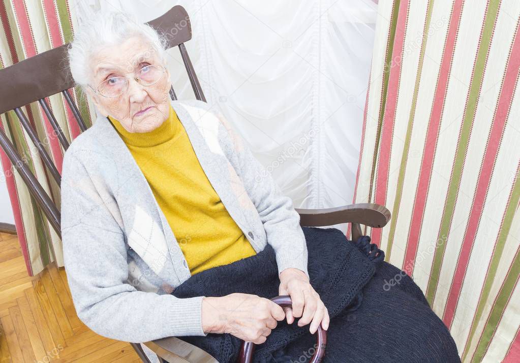 Elderly lady in chair