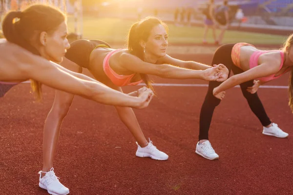 Young women performing warming up — Stock Photo, Image