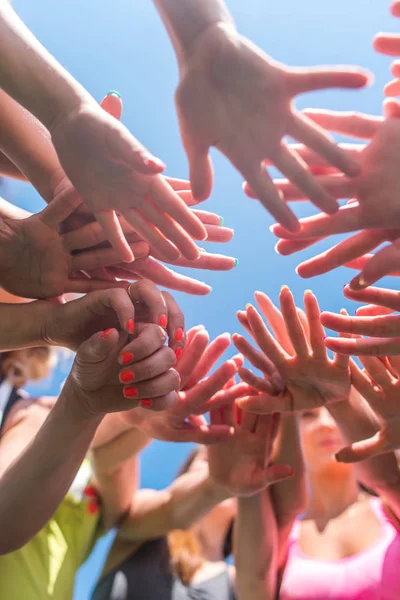 Women putting their hands together. — Stock Photo, Image