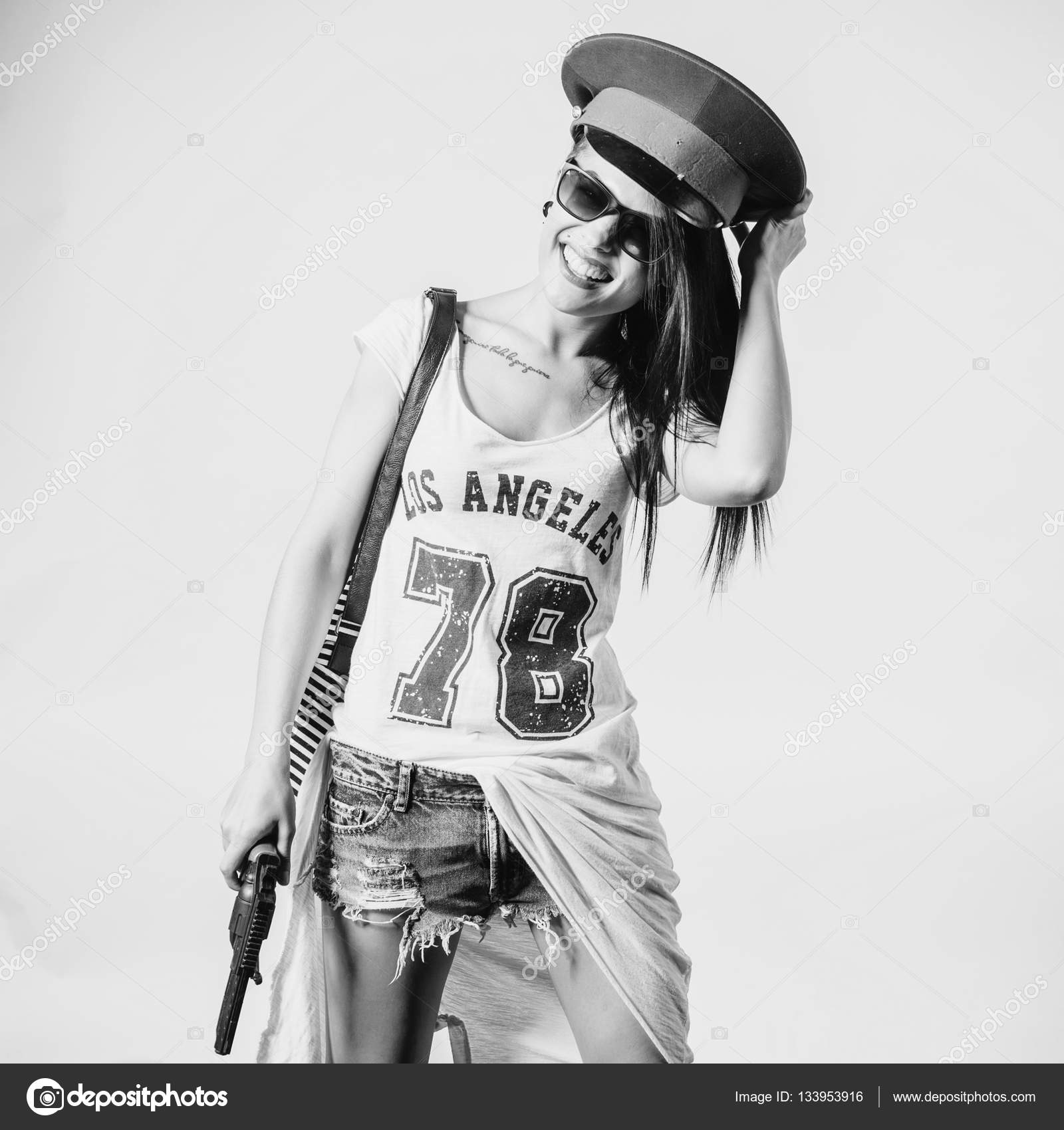 Fashion swag sexy girl holding gun Stock Photo by ©undrey 133953916