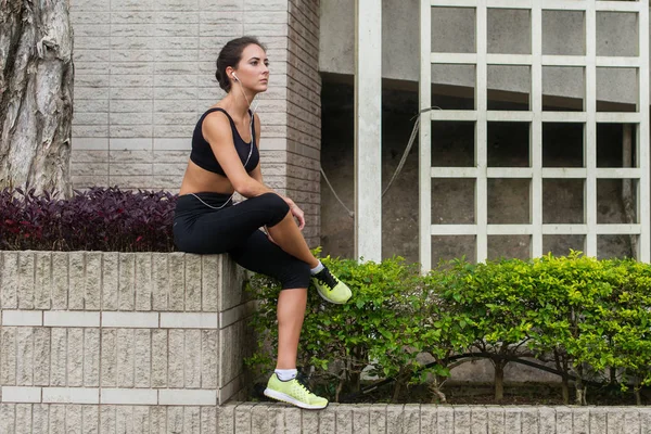 Young fitness woman having rest after running — Stock Photo, Image