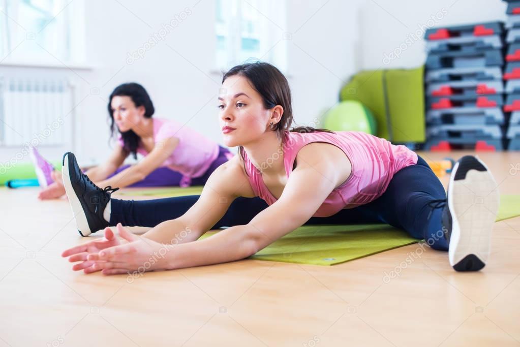 Fit women stretching 