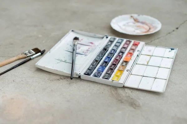 Watercolor aquarelle paints in box with palette — Stock Photo, Image