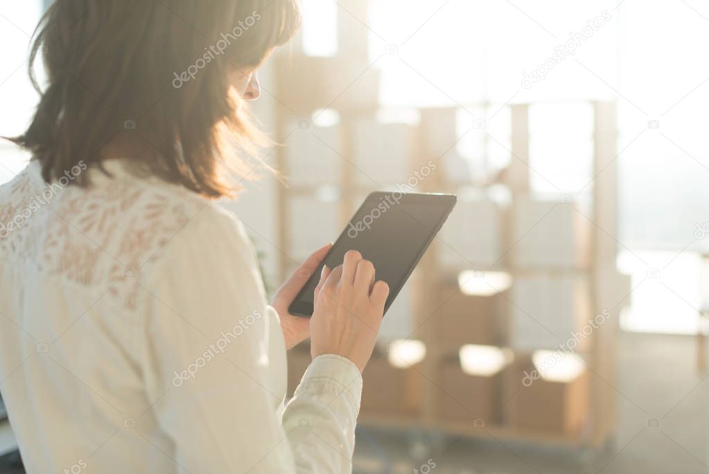 female hands holding tablet pc, typing, using touchscreen and wi-fi internet