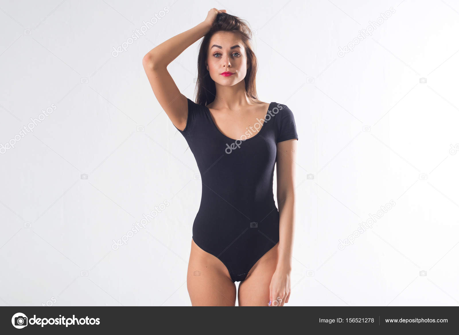 Cute Brunette Female Model Posing, Wearing Black One Piece Underwear Suit,  Touching Her Hair Stock Photo, Picture and Royalty Free Image. Image  93049577.