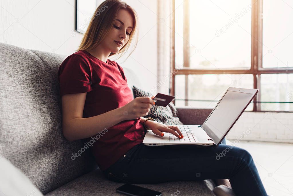 Online payment, woman holding credit card and laptop for online shopping.
