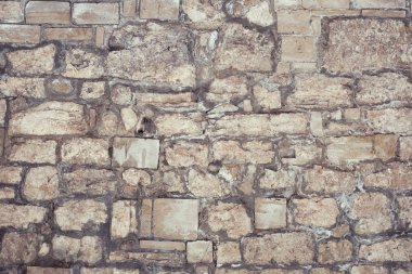 Arkaplan veya doku için taş bir duvarın parçası.
