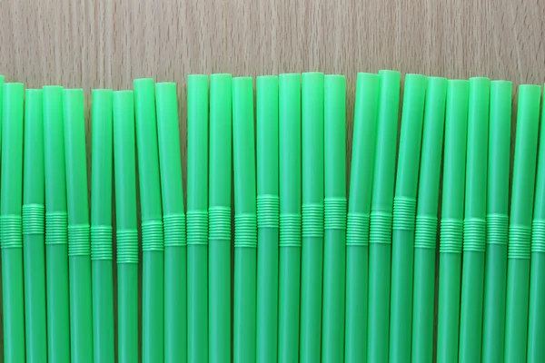 Drink tube of green color in abstract background. — Stock Photo, Image