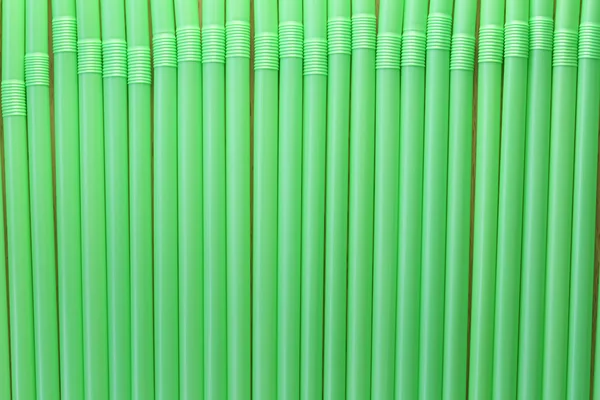 Drink tube of green color in abstract background. — Stock Photo, Image